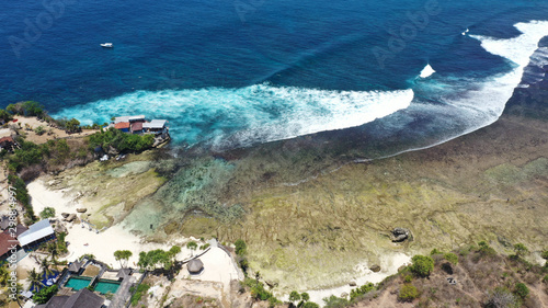 Beautiful drone view of secret beach, seen from Mahana Point, Ceningan Island, Bali. photo