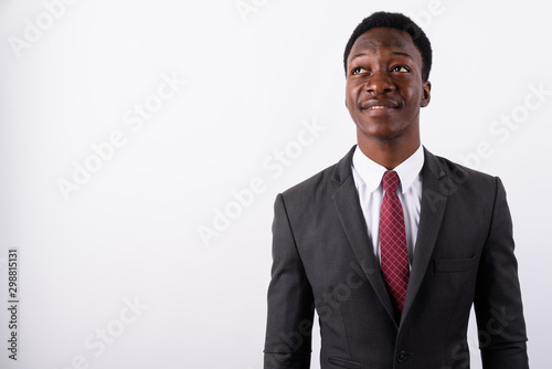 Young handsome African businessman wearing suit against white ba