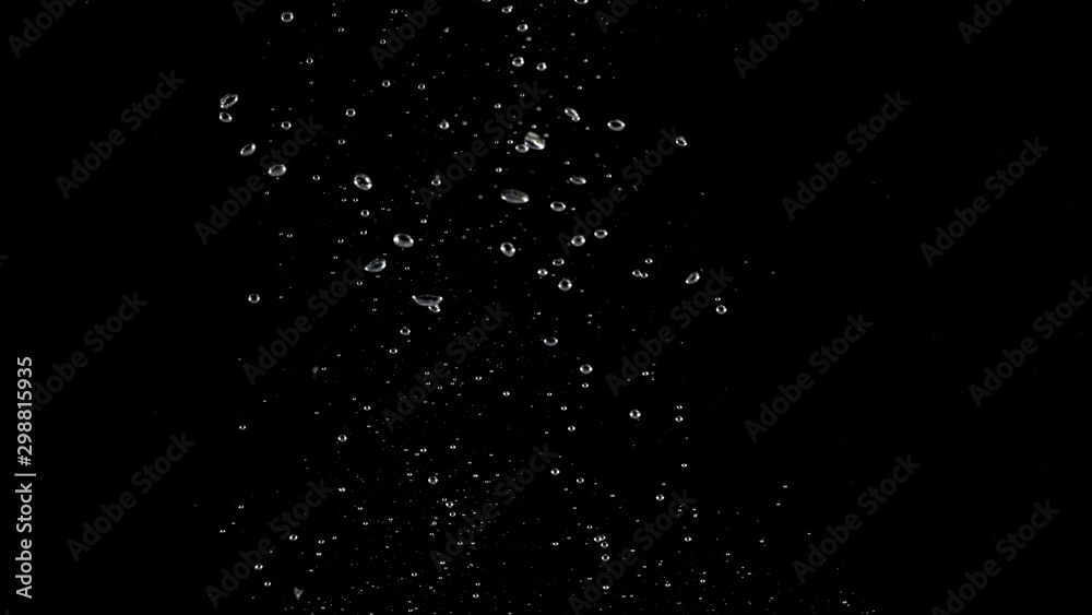 Blurry images of soda water bubbles splashing and floating up to top of water surface which little and big circle texture shaped up by gas power in carbonate drink make refreshing moment on black Blurry images of soda water bubbles splashing and floating up to top of water surface which little and big circle texture shaped up by gas power in carbonate drink make refreshing moment on black