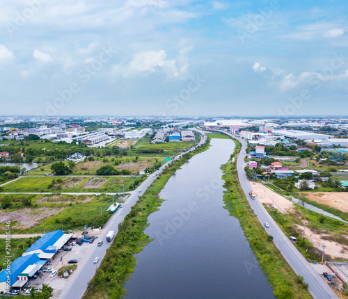 Aerial view of river with industrial sites.