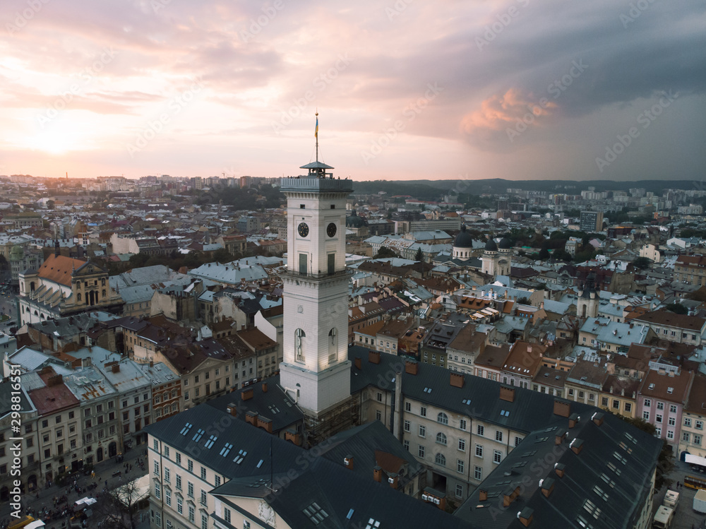 Obraz premium aerial view of lviv bell clock tower on sunset overcast sky