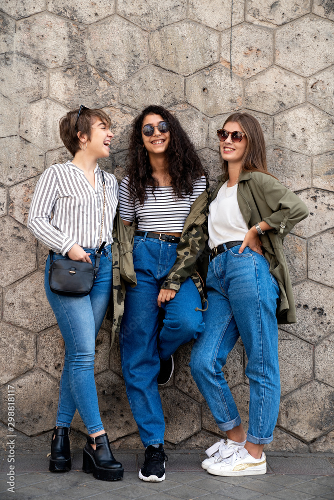 Three female friends looking at camera Three female friends looking at camera