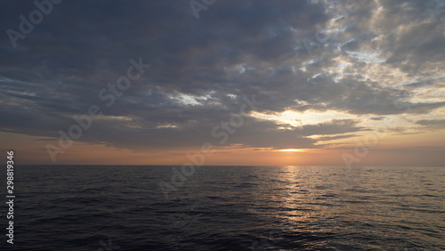 Sea scape with in sunrise with small island in middle in travel concept