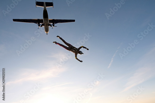 Skydiving. An active woman is flying in the sky.