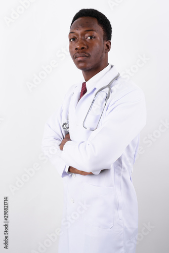 Young handsome African man doctor against white background