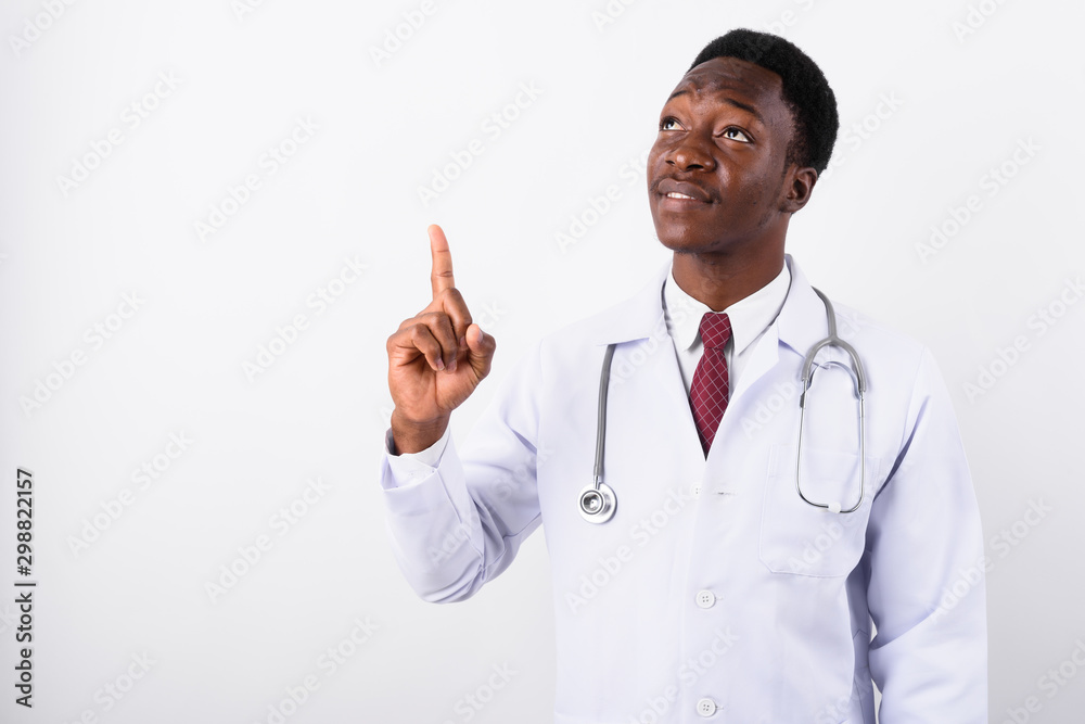 Young handsome African man doctor against white background Young handsome African man doctor against white background