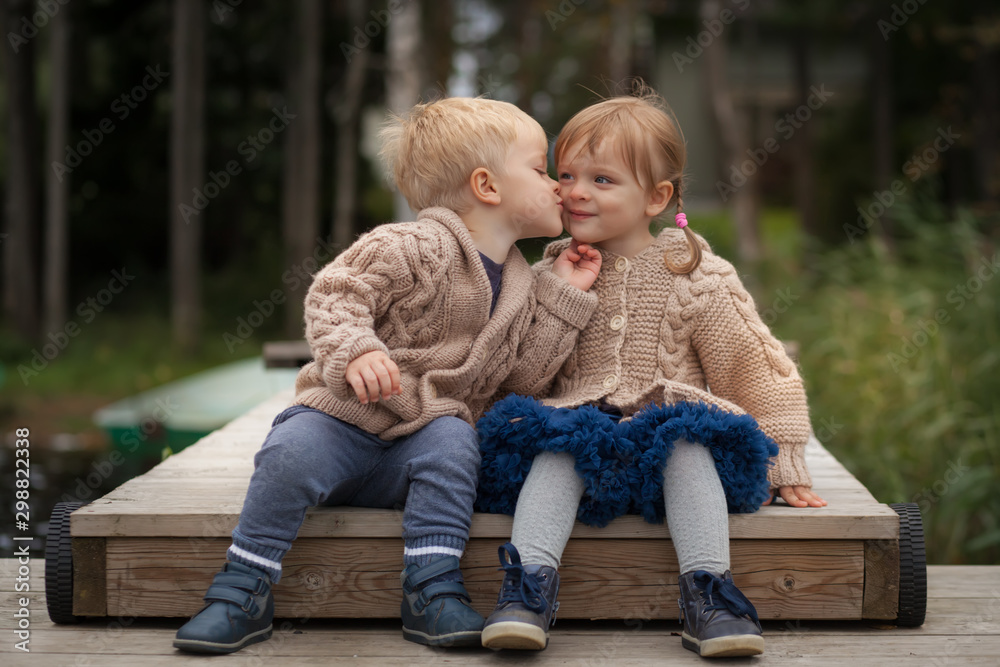 Funny twins boy and girl Stock Adobe Stock