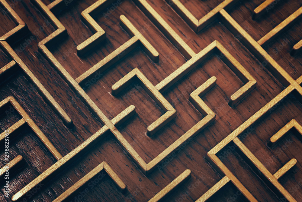 Wooden brown labyrinth maze puzzle close up Wooden brown labyrinth maze puzzle close up