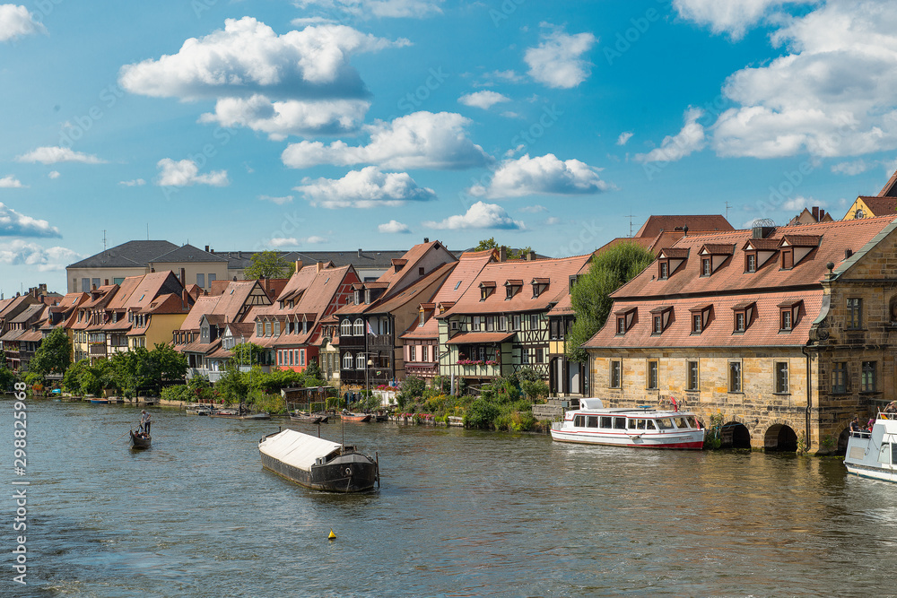 Bamberg, Germany - July 14, 2019; Half-timbered historic houses on a river in Bamberg, which are called little Venice of Bamberg