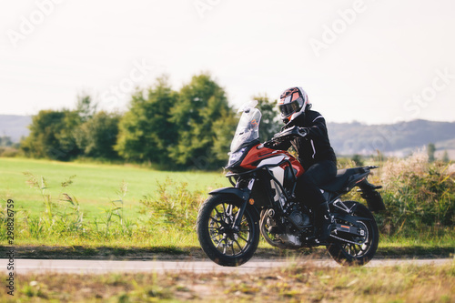 Drive a motorbike. Fast motorcycle in motion on asphalt road.