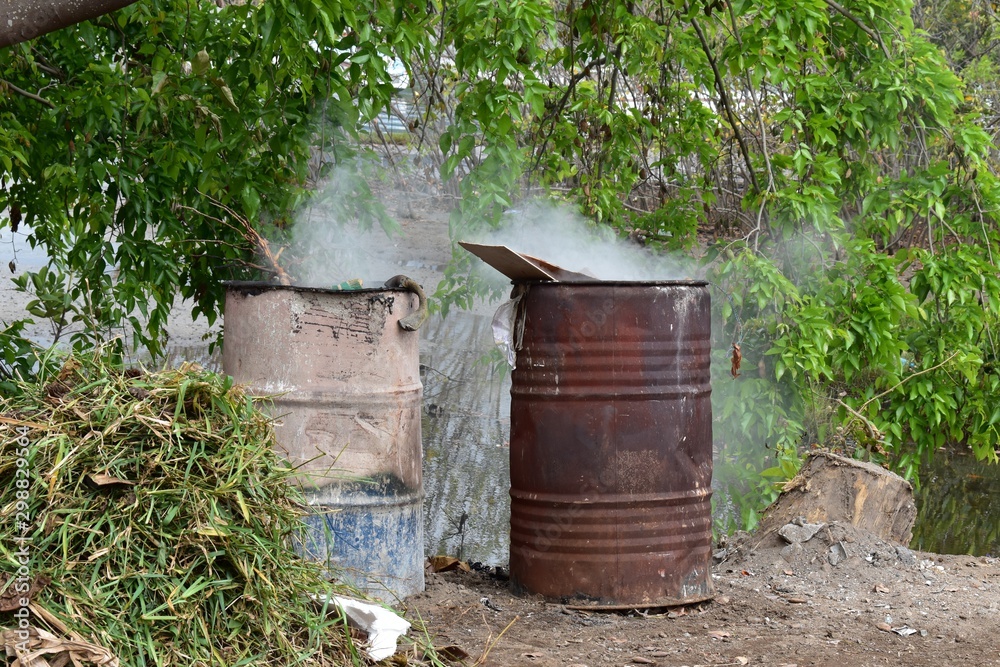 Pair of oil drums used to burn rubbish in the nature. Poor management