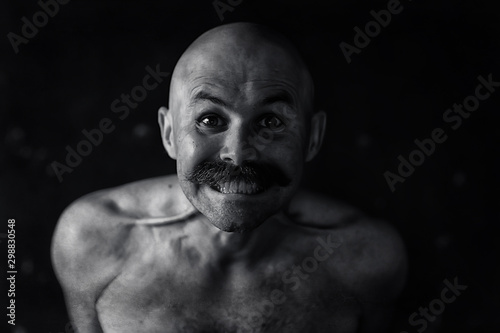 unusual portrait of a bald mustachioed young gentleman, eccentric mister, psychology concept photo