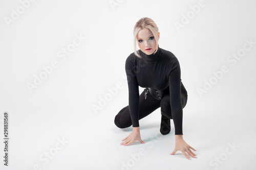 Young woman in tight clothes, black silhouette on white background.