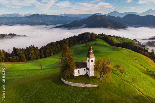 Autumn landscape of a beautiful church on the top of a hill, in Slovenia
