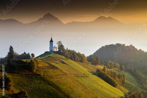Autumn landscape of a beautiful church on the top of a hill, in Slovenia