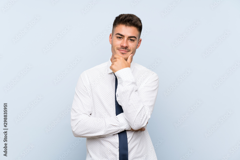 Handsome businessman over isolated blue background laughing Handsome businessman over isolated blue background laughing