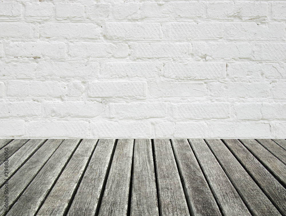 white brick wall and wood floor