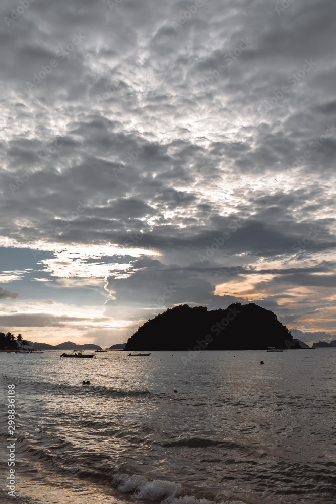 Beautiful cloudy sunset sky over wacy sea on tropical islands in El Nido Palawan the Philippines