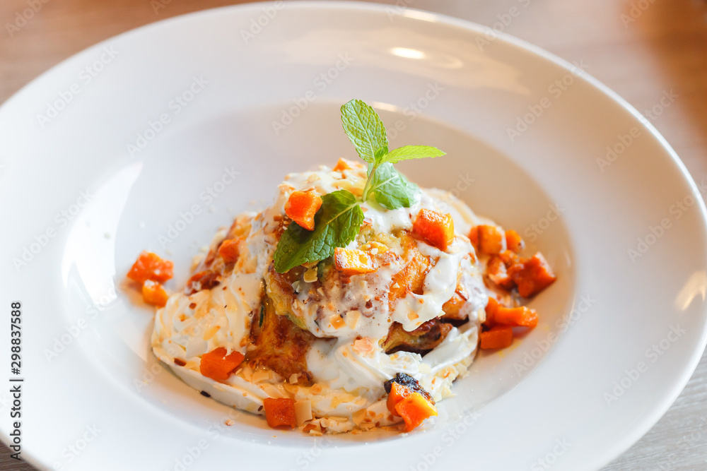 Zucchini pancakes with whipped cream, pumpkin, honey and herbs Zucchini pancakes with whipped cream, pumpkin, honey and herbs