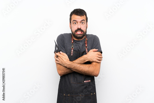 Barber man in an apron freezing