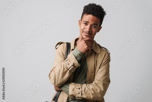 Image of handsome african american guy posing and looking at camera © Drobot Dean