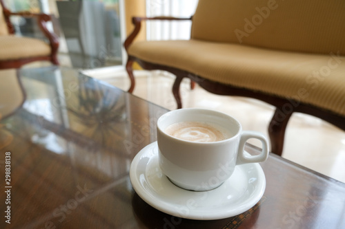 Coffee in a white cup and saucer. The hotel is all-inclusive. Break in the waiting room.