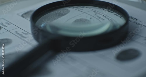 Wallpaper Mural Fingerprints card and magnifier close up in motion, CSI. Torontodigital.ca
