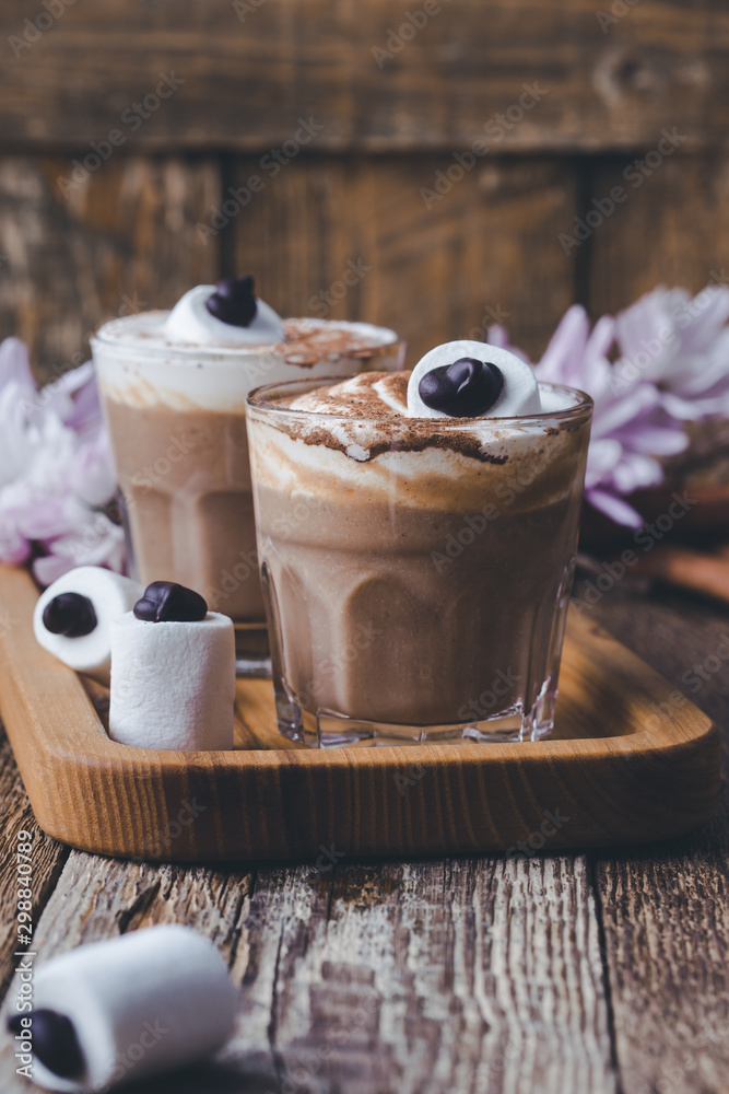 Obraz premium Happy Halloween monster, pumpkin spice latte with big marshmallow eye
