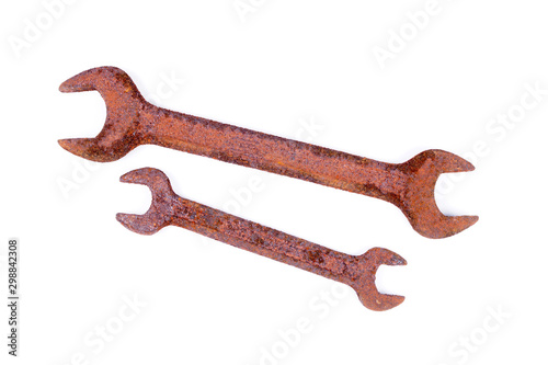 Old rusty wrench on white background, top view