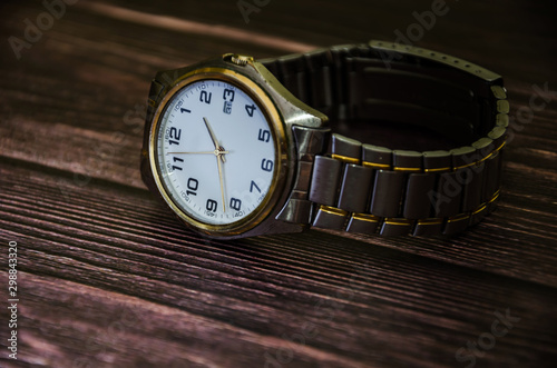 Wristwatch on a wooden background. Close-up.