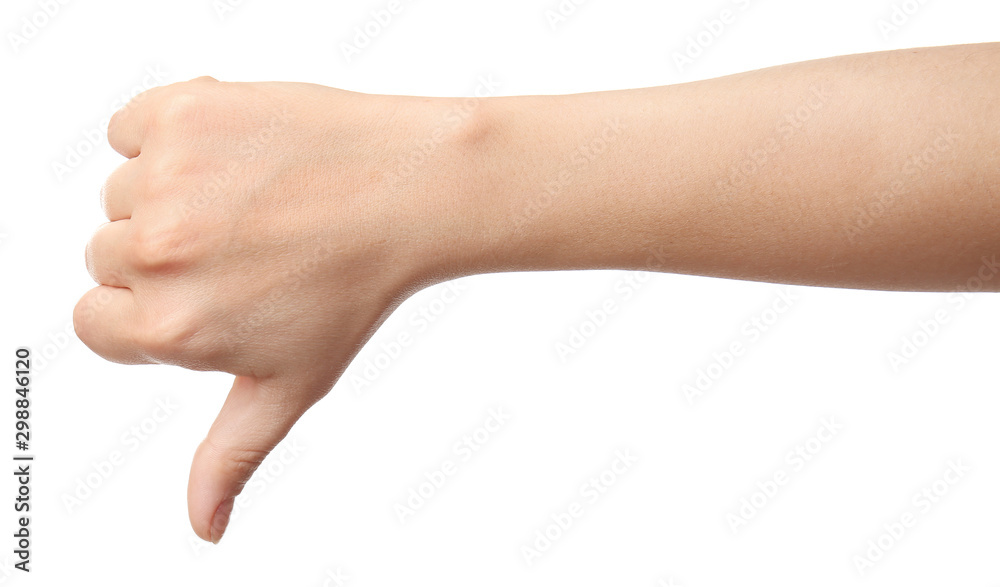 Hand of woman showing thumb-down gesture on white background Hand of woman showing thumb-down gesture on white background