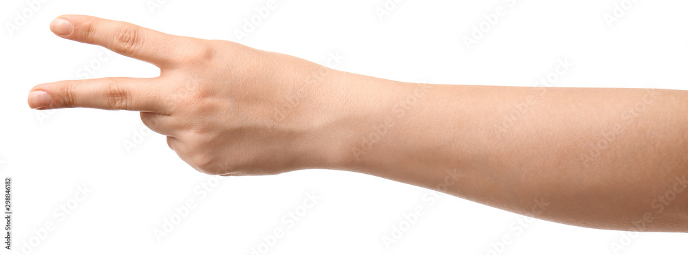Hand of woman showing victory gesture on white background Hand of woman showing victory gesture on white background