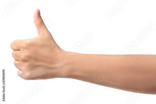 Hand of woman showing thumb-up gesture on white background