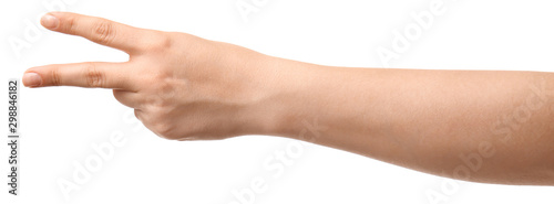 Hand of woman showing victory gesture on white background