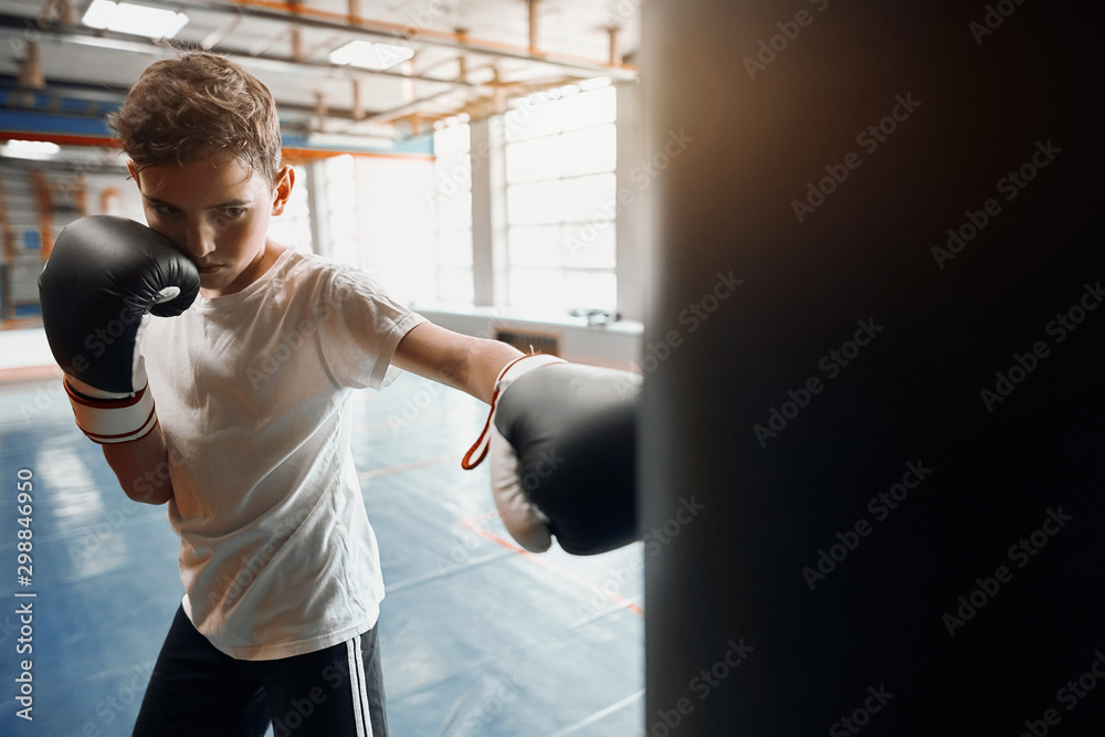 agressive angry boy is good at kickboxing, close up photo. motivation concept agressive angry boy is good at kickboxing, close up photo. motivation concept