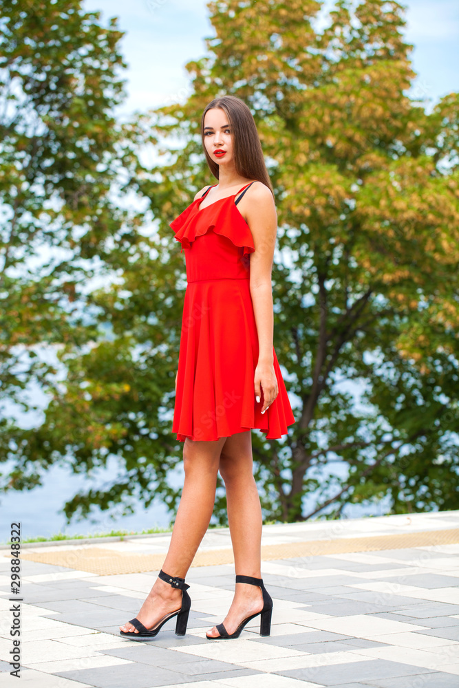 Beautiful brunette model in sexy red dress Beautiful brunette model in sexy red dress