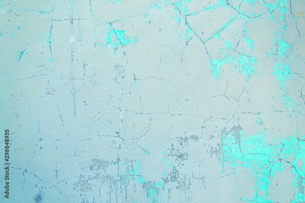 Texture of an old plastered wall painted with blue and white paint.