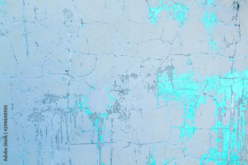 Obraz premium Texture of an old plastered wall painted with blue and white paint.