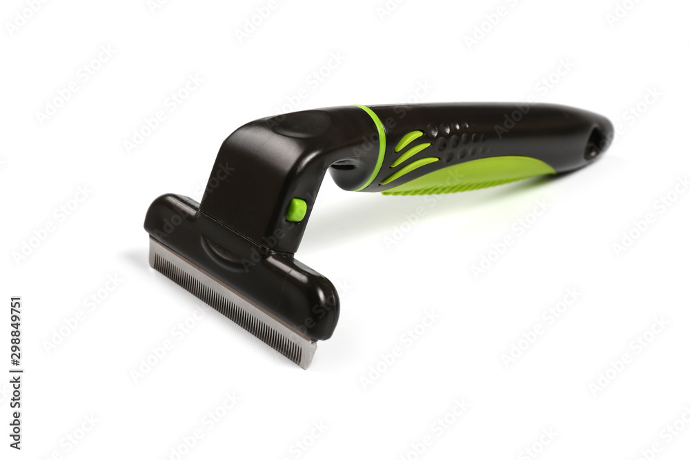 Furminator for combing fur in pets on a white background. Isolate