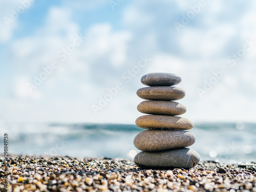 Stones balance on beach wit...