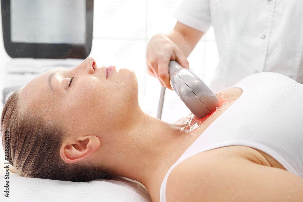 Fototapeta premium Thermolifting of the skin. A rejuvenating cosmetic care treatment in aesthetic medicine clinic.