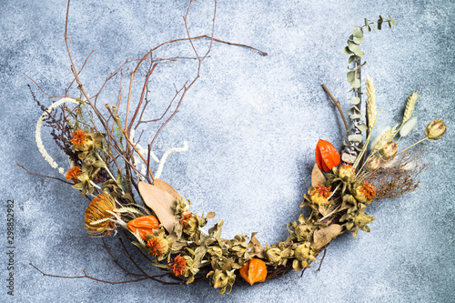 Autumn wreath made of dried flowers.