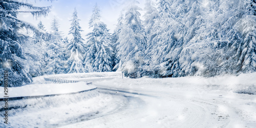 Winter beautiful snowy road snow or landscape forest and trees covered with snow in background.