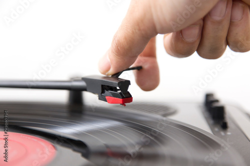 Tableau sur toile Close up of a man putting a Vinyl on turntable.