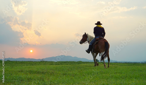cowboy and horse at first light,mountain, river and lifestyle with natural light background	