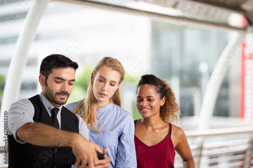 Business People Walking Together with hand holding book and folder at outdoor