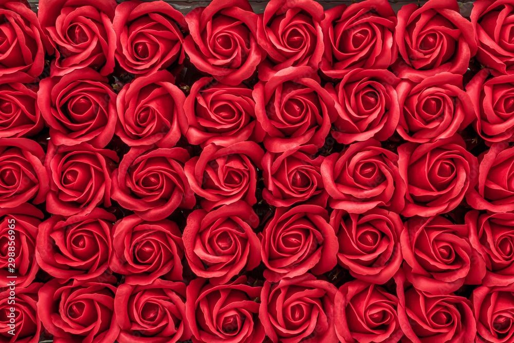 Red rose flowers made from soap close-up background