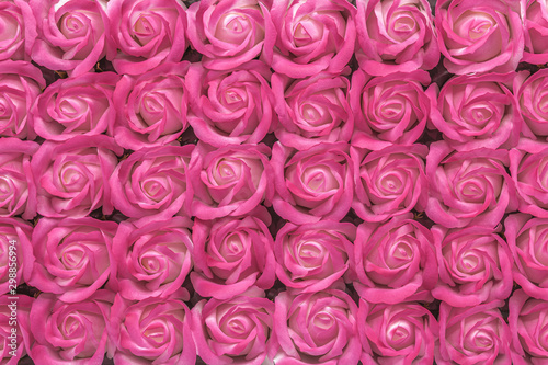Pink with white rose flowers made from soap close-up background