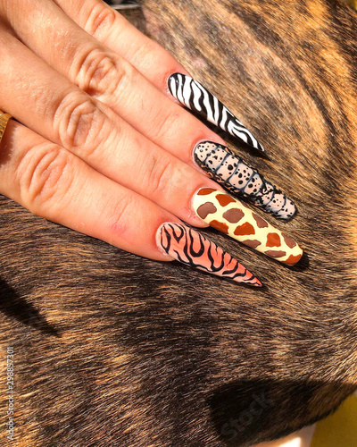 Hands with artificial nails in different style