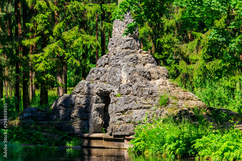 Dam with Cascade and Tuff Grotto in Catherine park at Tsarskoye Selo in Pushkin, Russia Dam with Cascade and Tuff Grotto in Catherine park at Tsarskoye Selo in Pushkin, Russia